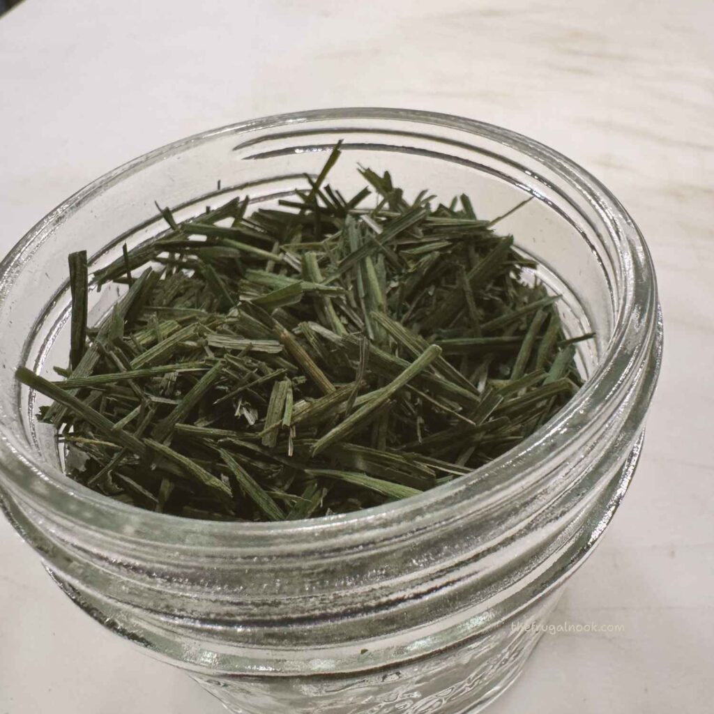 Dried chives cut small in a glass mason jar