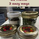 Glass mason jars of dried herbs with handwritten labels, with the title How to Dry Herbs at Home